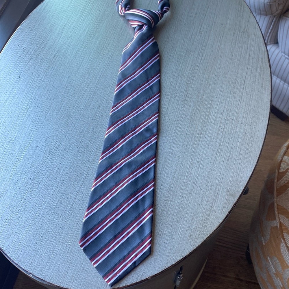Mens tie. Gray with red white and black striped pattern